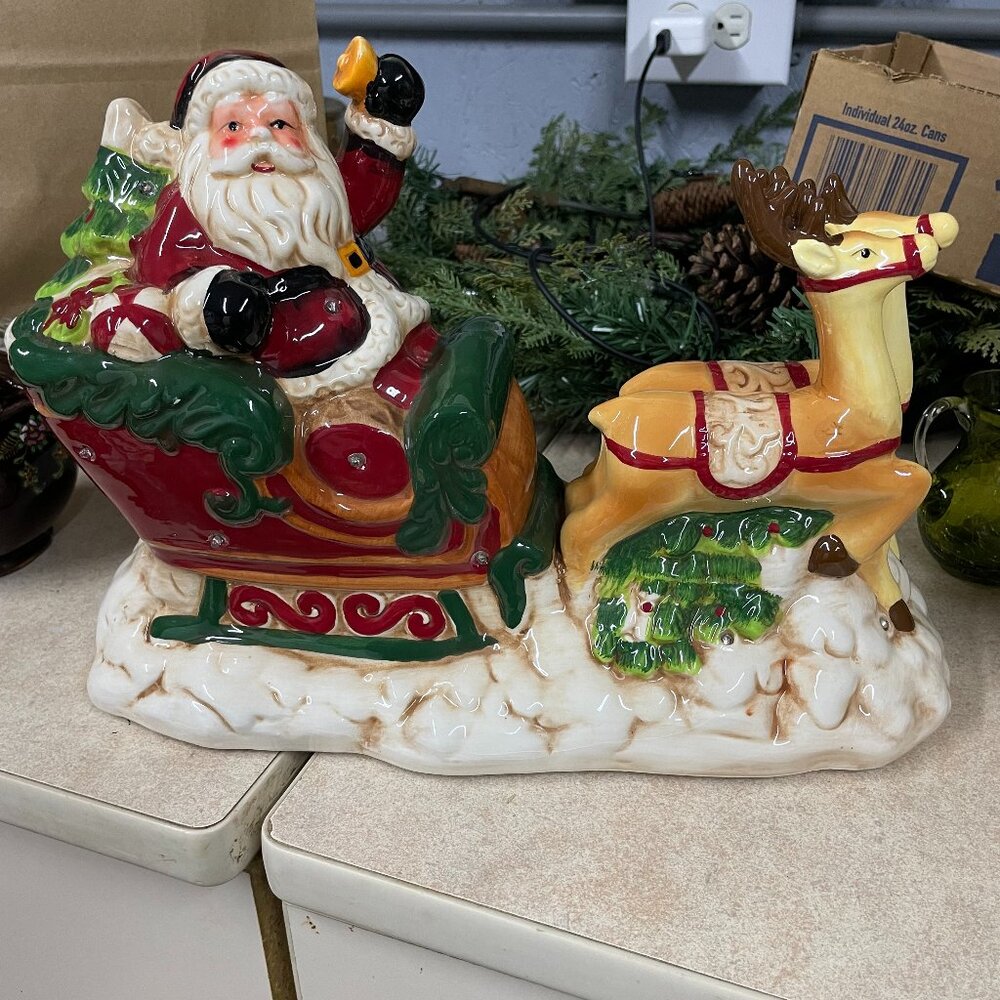 Ceramic Santa and Sleigh lights up and plays music
